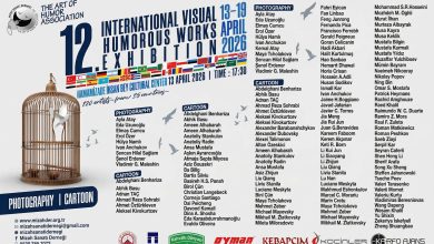 12th International Visual Humorous Works Exhibition poster featuring global cartoon and photography artists.