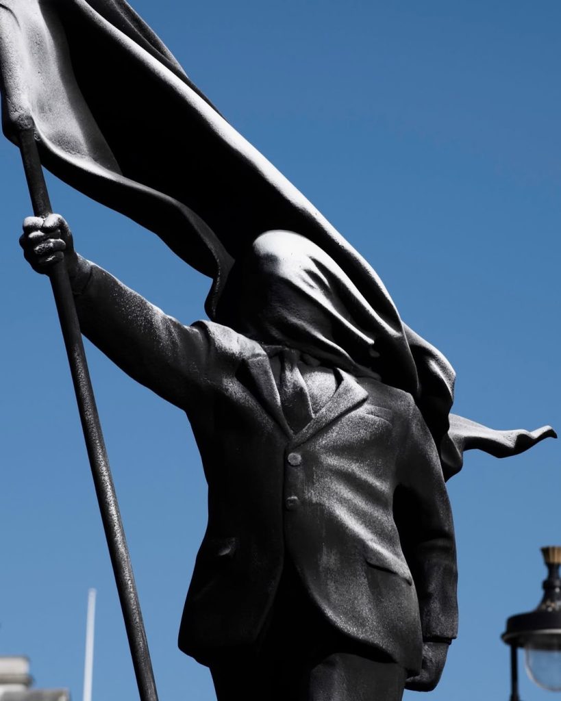 Banksy-Blind-Patriotism-Sculpture-2026-2-819x1024 Banksy’s New Sculpture in Central London: A Message of "Blind Patriotism" at Waterloo Place